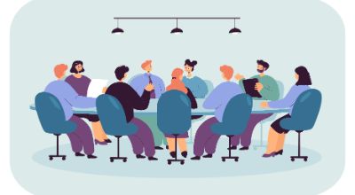 Politician sitting at round table in boardroom